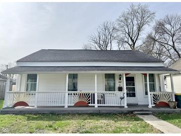 Charming single-story home with a welcoming front porch and decorative sunburst accents at 323 E Adams St, Franklin, IN 46131