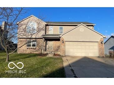 Charming two-story home featuring a two-car garage, brick accents, and well-maintained landscaping at 480 Village Blvd, Mooresville, IN 46158