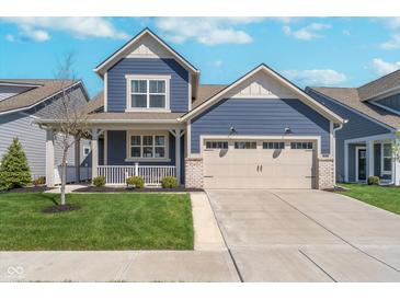 Charming blue two-story home with a two-car garage and inviting front porch at 622 Ehrlich Ln, Westfield, IN 46074
