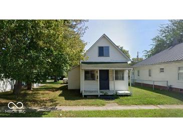 Charming two-story home with a classic architectural style and a well-maintained front yard at 116 N Vine St, Shelbyville, IN 46176