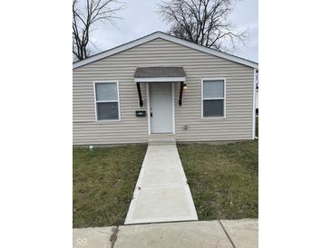 Charming single story home with neutral siding, inviting front door, and walkway at 2968 N Gale St, Indianapolis, IN 46218
