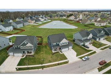 Aerial view of a neighborhood with a pond, showcasing the property's location and community amenities at 7391 Blanford Dr, Plainfield, IN 46168