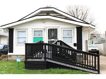 Charming home with black and white painted exterior, convenient access ramp and Ring security at 1311 N Denny St, Indianapolis, IN 46201