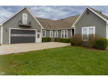 Charming home featuring a spacious driveway, two-car garage, and lush green lawn at 13151 Walters Rd, Martinsville, IN 46151