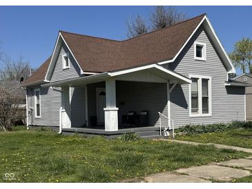 Charming home featuring a covered front porch, tidy landscaping, and a classic architectural design at 1922 N Cherry St, Columbus, IN 47201