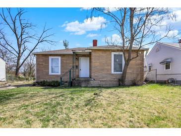Charming single story home with brick veneer and a yard with mature trees at 3343 N Drexel Ave, Indianapolis, IN 46218