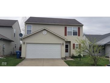 Charming two-story home with a two car garage and neatly maintained landscaping at 4063 Orchard Valley Blvd, Indianapolis, IN 46235
