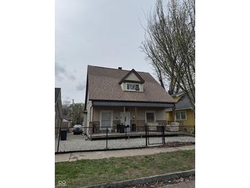 Charming home featuring a cozy front porch and well-maintained exterior at 408 N Colorado Ave, Indianapolis, IN 46201