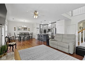 Open concept living space with living room, dining area, and modern kitchen, perfect for entertaining at 11339 Fonthill Dr, Indianapolis, IN 46236