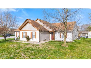 Charming single-Gathering home featuring a well-maintained lawn and classic architectural details at 448 Yorktown Ln, Avon, IN 46123