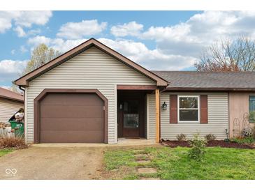 Charming single-story home with a cozy front porch and attached garage at 5431 Carlton Ct, Indianapolis, IN 46224