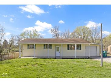 Charming ranch-style home with a covered front porch and spacious front yard at 8745 Big Bend Rd, Martinsville, IN 46151