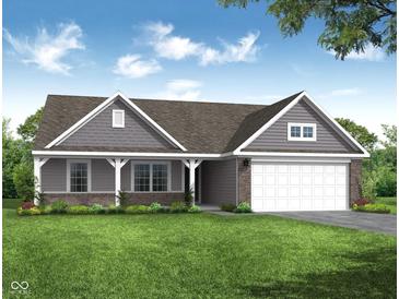 Charming single-story home featuring a well-manicured lawn, brick accents, and an attached two-car garage at 19245 Red Willow Ln, Noblesville, IN 46062