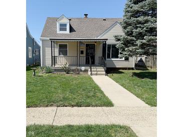 Charming single-Gathering home featuring a covered porch, well-maintained lawn, and traditional design at 2050 Winton Ave, Indianapolis, IN 46224