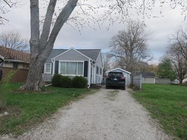Charming single-Gathering home with a gravel driveway and detached garage, perfect for comfortable living at 2012 N Janney Ave, Muncie, IN 47304