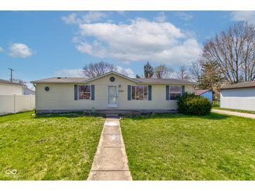 Charming single-story home with a well-maintained lawn and inviting walkway to the front door at 220 E Meridian St, Atlanta, IN 46031