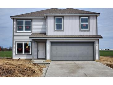 Charming two-story home features gray siding, a gray garage door, and modern windows at 3276 W Longbranch Dr, Monrovia, IN 46157