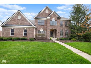 Stunning two-story brick home featuring manicured landscaping and an inviting front entrance at 442 Athens Pl, Westfield, IN 46074