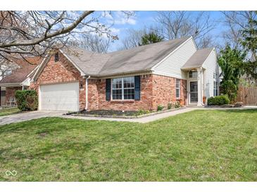 Charming brick and siding home with a well-manicured lawn, attached garage, and welcoming front entrance at 5105 Hawks Crescent Ct, Indianapolis, IN 46254
