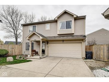 Charming two-story home featuring a two-car garage and a cozy front porch at 591 Scotch Pine Dr, Greenwood, IN 46143