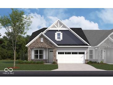 Charming home with a stone and siding exterior, two-car garage, and landscaped front yard at 261 Onset Way, Westfield, IN 46074