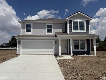 Newly constructed two-story home featuring a two-car garage, covered porch, and mixed siding at 3297 Godby Dr, Sheridan, IN 46069