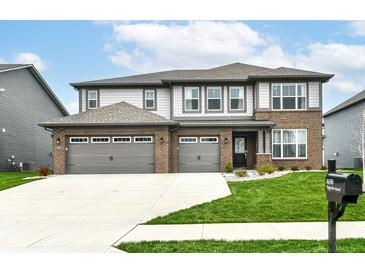 Charming two-story home with a three-car garage and well-manicured front yard at 3650 Tipperlin Rd, Bargersville, IN 46106