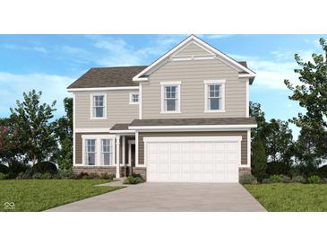 Charming two-story home with neutral siding, a two-car garage, and a well-manicured lawn at 1147 Stubble Run, Danville, IN 46122