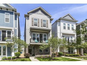 Attractive two-story home boasting a charming balcony and brick facade at 13316 E Lieder Way, Fishers, IN 46037