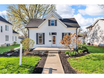 Charming two-story home with a well-maintained front yard and inviting entrance, perfect for a cozy Gathering residence at 143 W Washington St, Mooresville, IN 46158