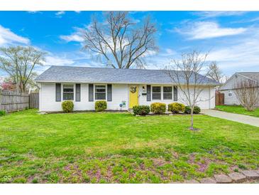 Charming single-story home with a well-maintained lawn, tidy landscaping, and a welcoming yellow front door at 1508 Douglas Dr, Franklin, IN 46131