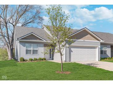 Charming single-Gathering home boasts manicured lawn and a two-car garage in a residential neighborhood at 1616 Capra Ct, Beech Grove, IN 46107
