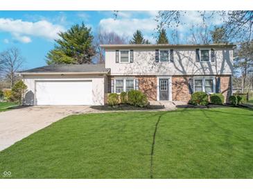 Charming two-story home with a well-manicured lawn and attached two car garage at 4106 Armon Ct, Carmel, IN 46033