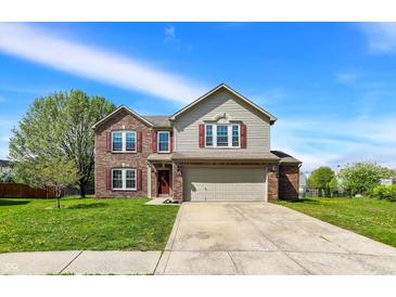 Charming two-story home with a well-manicured lawn, attached two car garage, and brick and siding accents at 8531 Aberdeenshire Ct, Indianapolis, IN 46259