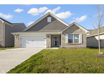 Charming single-story home with a brick and siding exterior, attached garage, and well-maintained lawn at 11622 Brookwood Trace Dr, Indianapolis, IN 46229