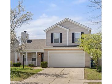 Charming two-story home featuring neutral siding, a two-car garage, and a well-manicured lawn at 14953 Lovely Dove Ln, Noblesville, IN 46060