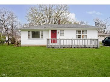 Charming single-story home with a red front door, white siding, and a well-manicured lawn at 217 S 17Th Ave, Beech Grove, IN 46107