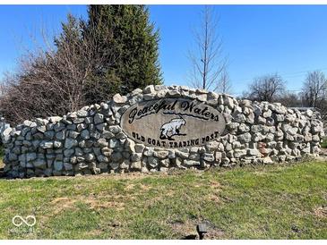A stone entrance sign for Peaceful Waters and Old Goat Trading Post welcomes visitors at 3559 N Us Highway 41, Bloomingdale, IN 47832
