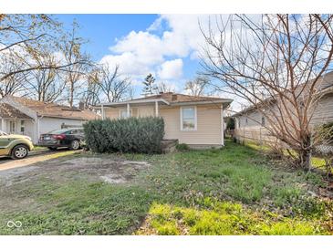 Cozy one-story home featuring vinyl siding and a quaint covered porch at 1504 S Lynhurst Dr, Indianapolis, IN 46241