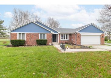 Charming single-story brick home featuring a well-manicured lawn and attached two-car garage at 1737 W 200 N, Greenfield, IN 46140
