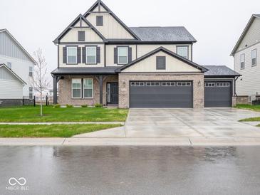 Charming two-story home features a 3-car garage and a welcoming brick facade at 20398 N Pacific Ave, Westfield, IN 46074