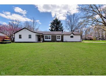 Charming single-story home with a well-maintained lawn and inviting curb appeal on a bright day at 7859 Jennifer Ln, Brownsburg, IN 46112