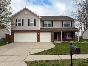 Charming two-story home features a spacious driveway and manicured lawn at 796 Booneway Ln, Bargersville, IN 46106