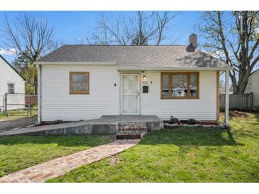 Charming single-story home with a brick walkway, white siding, and well-maintained front lawn at 2221 Groff Ave, Indianapolis, IN 46222