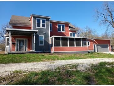 Charming two-story home featuring a screened in porch, garage, and appealing two-tone color scheme at 359 N Jefferson St, Martinsville, IN 46151