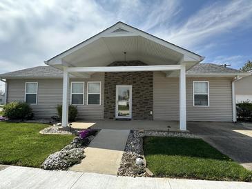 Charming single-story home with welcoming covered porch and landscaped front yard at 600 Fairlane Dr, Edinburgh, IN 46124