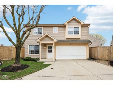 Charming two-story home with a well-maintained lawn and attached two-car garage at 693 Cembra Dr, Greenwood, IN 46143