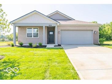 Charming single-story home with a well-maintained lawn and neutral-colored exterior at 3949 Donaldson Creek Ct, Clayton, IN 46118