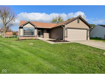 Charming single-story home with well-maintained lawn, attached garage, and inviting curb appeal at 2206 Tansel Crossing Cir, Indianapolis, IN 46234