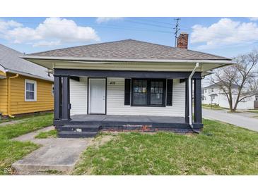 A charming home with a front porch and fresh, clean exterior paint awaits at 402 W 38Th St, Indianapolis, IN 46208